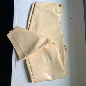 Cream colored faux leather pants, soft nylon interior